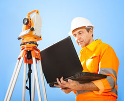 Land surveyor with theodolite